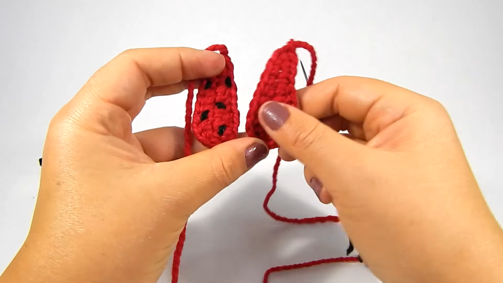 Two red crochet ladybug wings