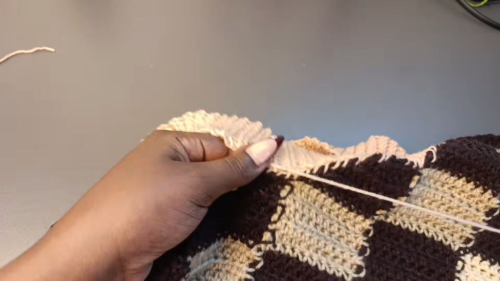 Ribbed band attached to the finished crochet argyle skirt