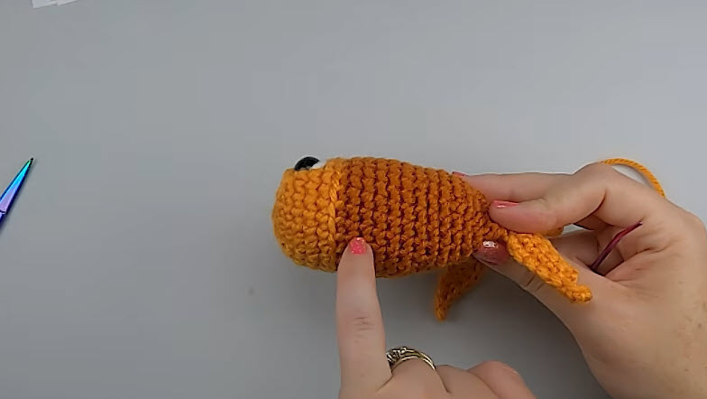 Fins and tail sewn onto the fish body.