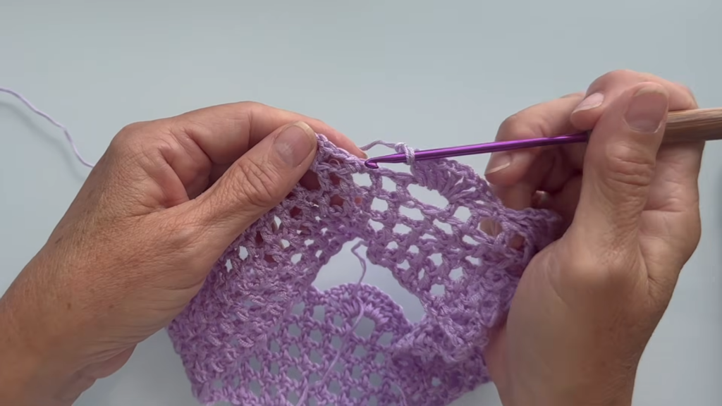 Continuing the open mesh pattern across the top