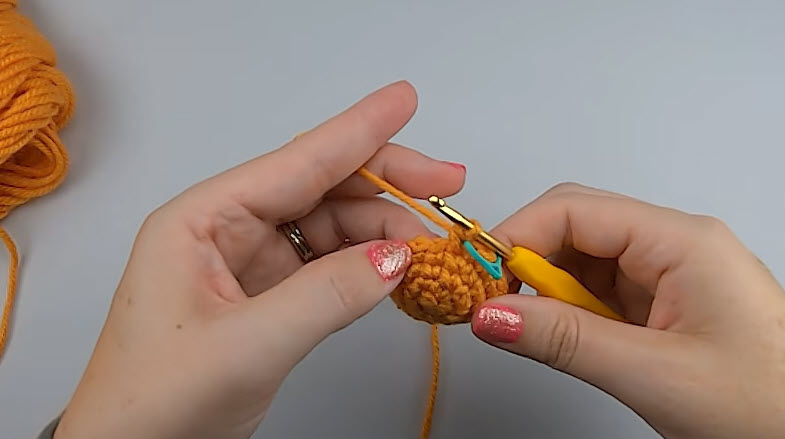 Head rounds growing with a stitch marker in place.
