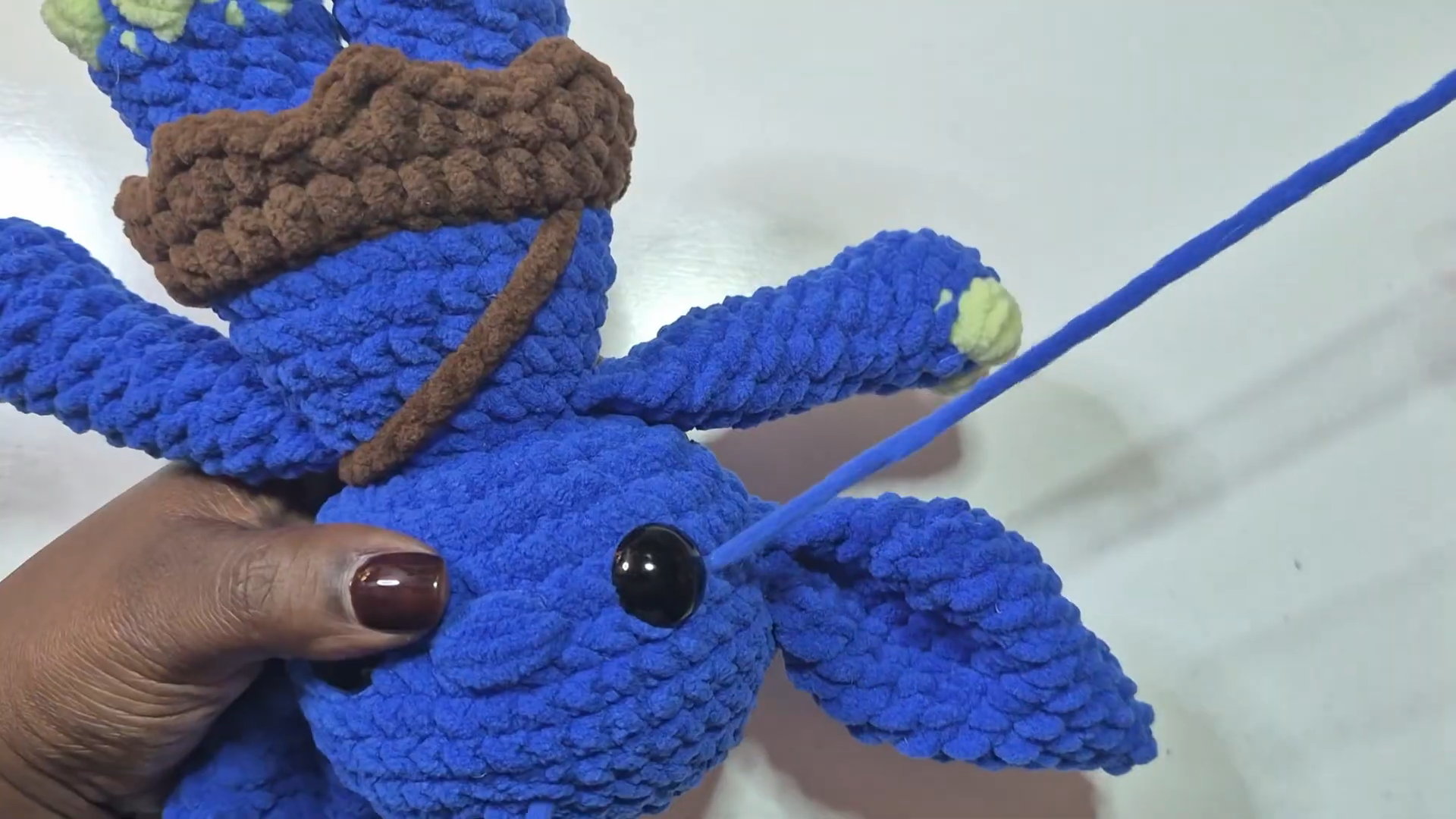 Finished blue goblin doll with brown pouch and safety eyes