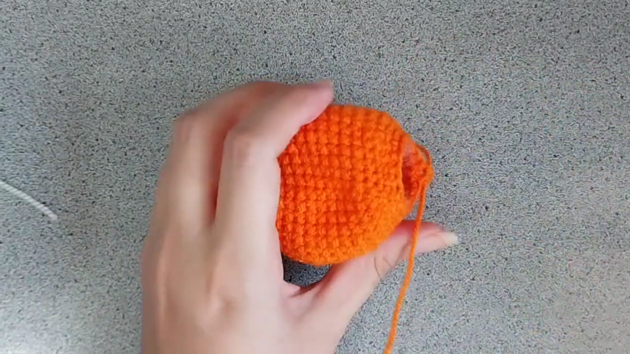 Orange body almost closed, with a small opening left