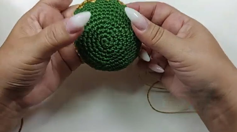 Rounded green dome with a gold edge showing