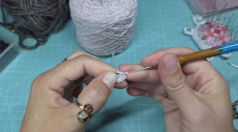 Starting a tiny pink amigurumi head with fine thread