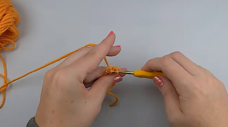 Six single crochets worked into a gold magic ring.