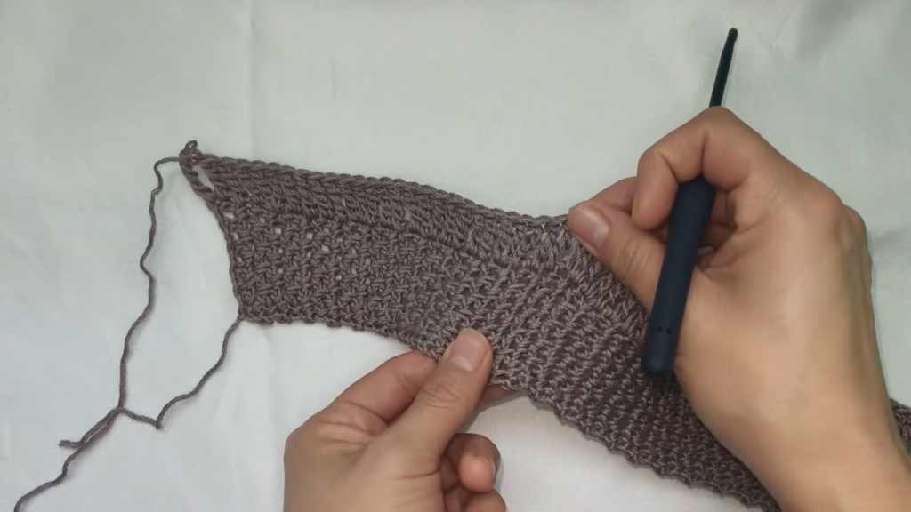 Hold the strip curved while shaping it around the hook