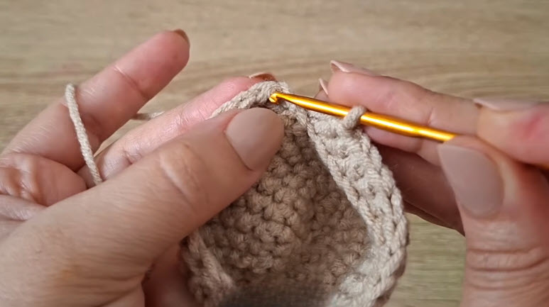 Straight sides forming the cup shape of a crochet dumpling keychain